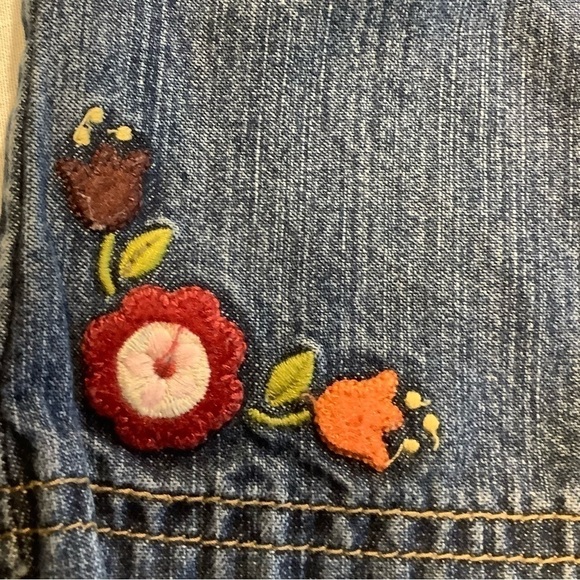 GYMBOREE blue jeans with red flowers and bows. Size 12-18 months. - Picture 2 of 5